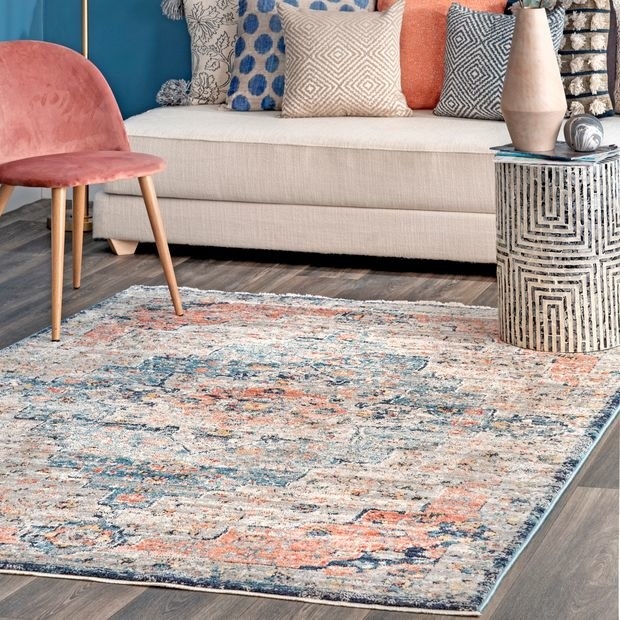 blue and pink rug in a living room