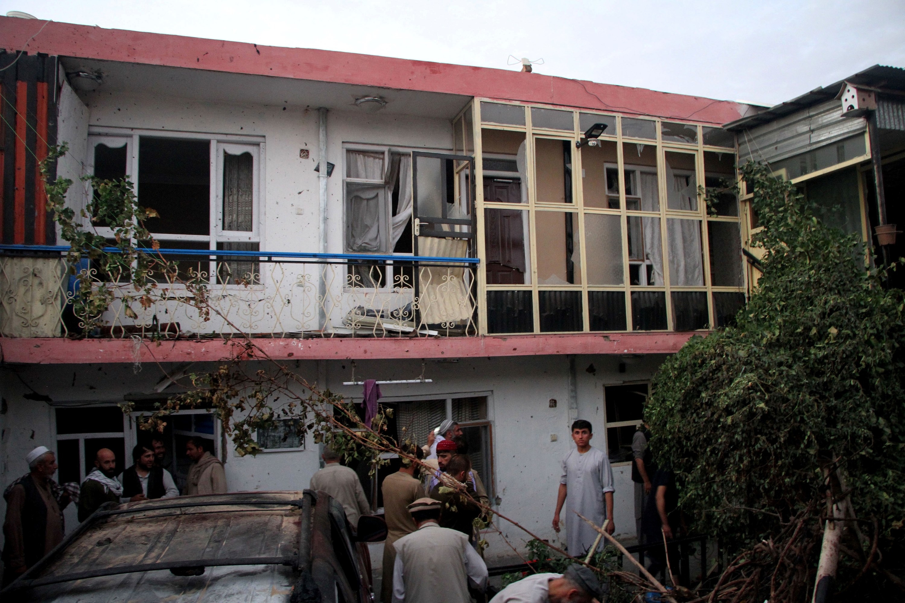 People come to observe the scene where an airstrike was carried out 