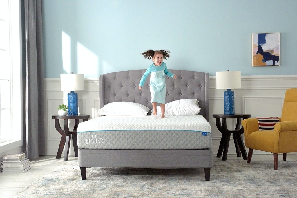 child model jumping on an idle mattress