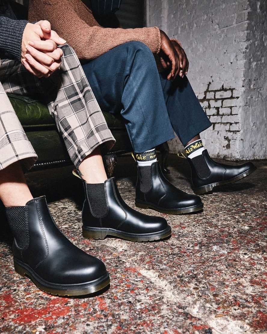 models wear the black Chelsea boots with and without high-rise socks