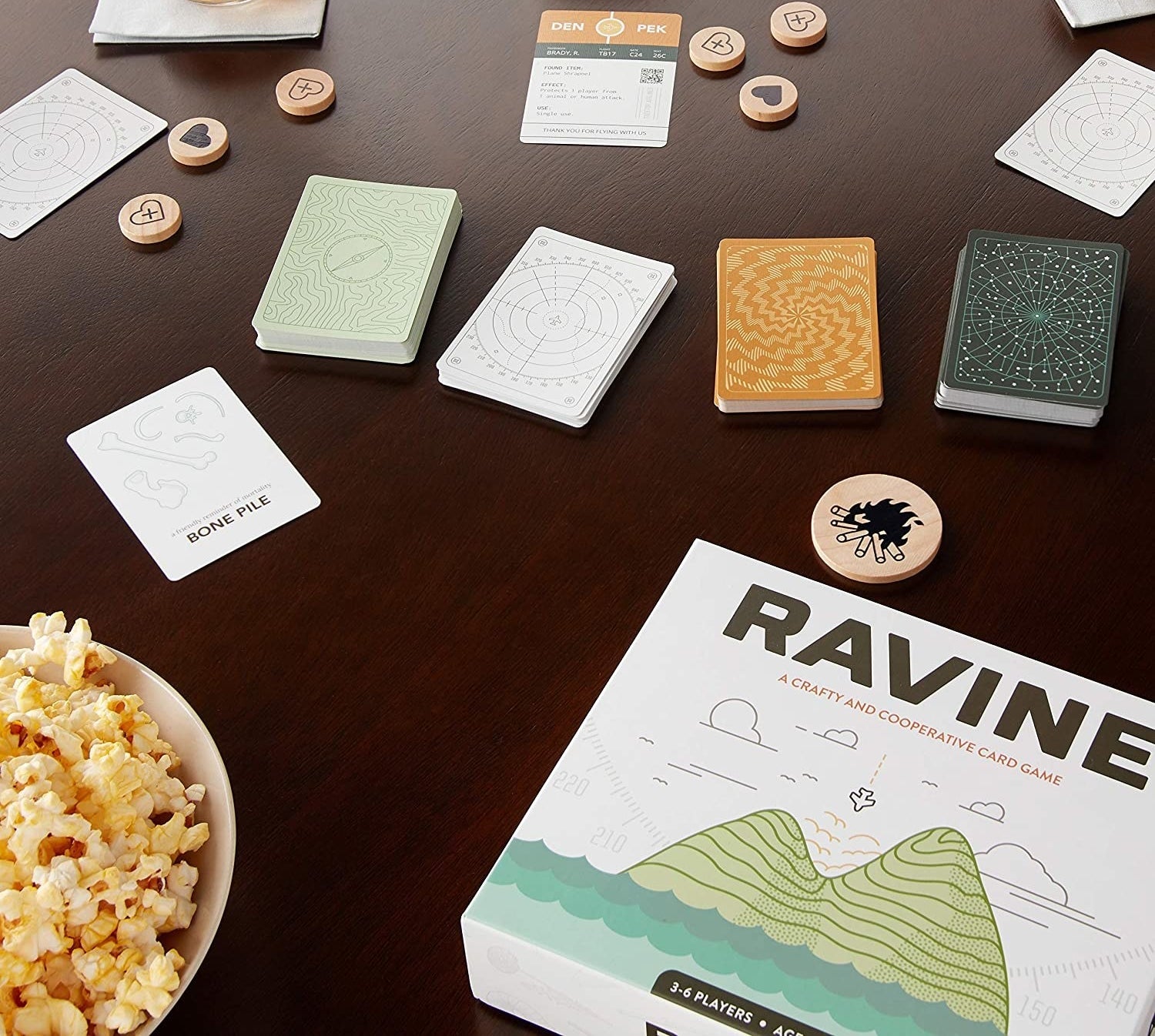 the game table box on a table with different cards