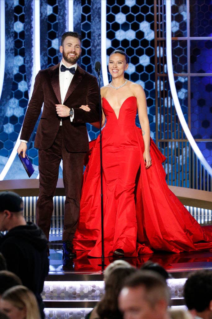 Chris and Scarlett walking on stage to present an award