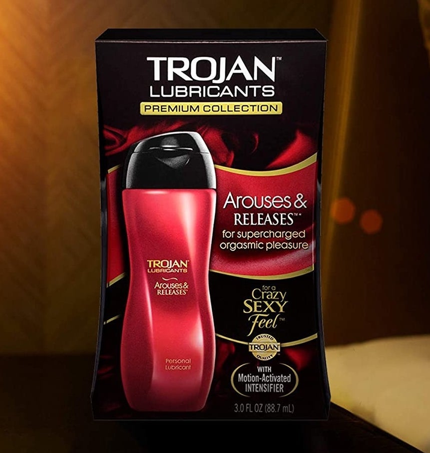 Red bottle of Trojan Arouses & Releases lubricant