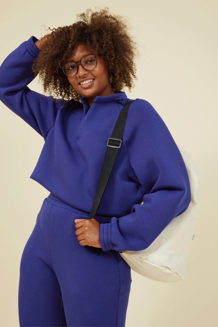 model wearing indigo sweater