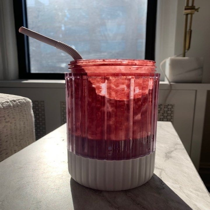 A raspberry-colored smoothie I made in a jar