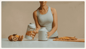 A gif of a model twisting in the blender jar and blending a smoothie