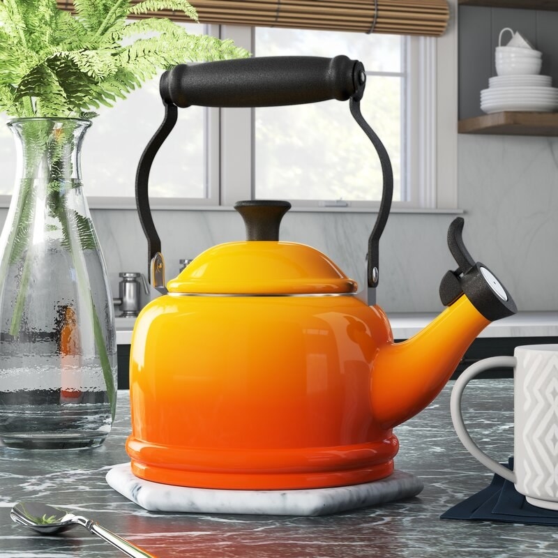 orange teapot with an ombre effect