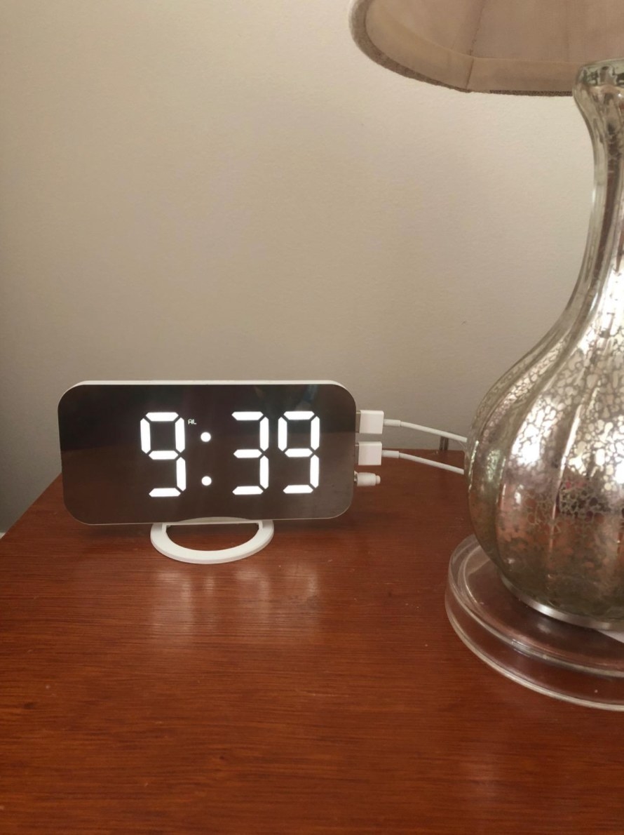 the reviewer&#x27;s image of the digital alarm clock in white