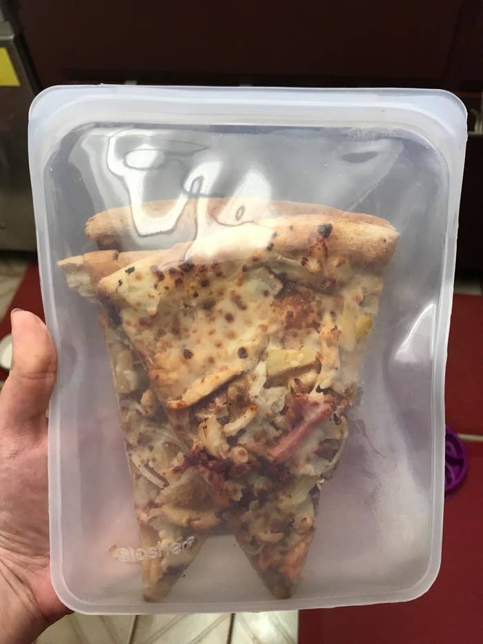 reviewer image of two slices of pizza in a Stasher bag
