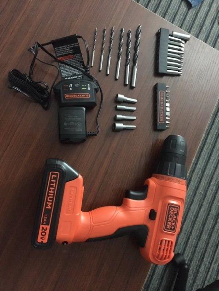 the reviewer&#x27;s image of the cordless drill with it&#x27;s parts