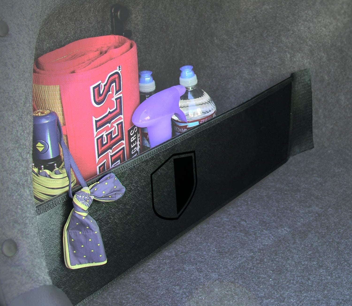the velcro organizer attached to the side of a car trunk