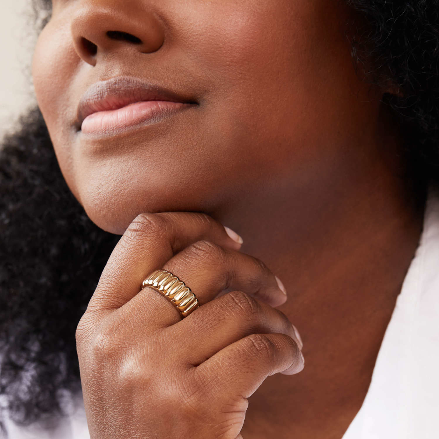 model wearing gold ring