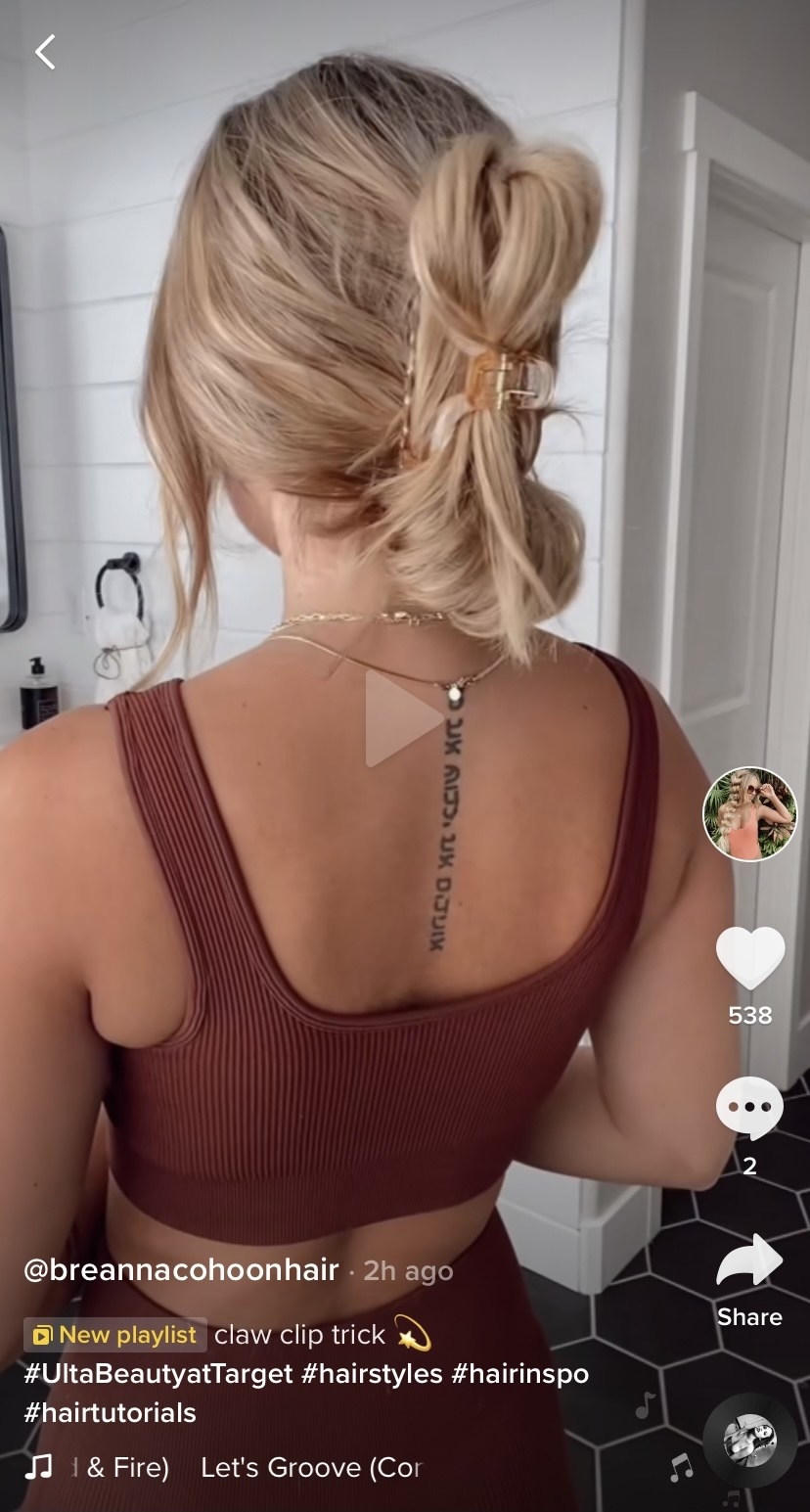 A TikTok screengrab of hair wrapped into a claw clip