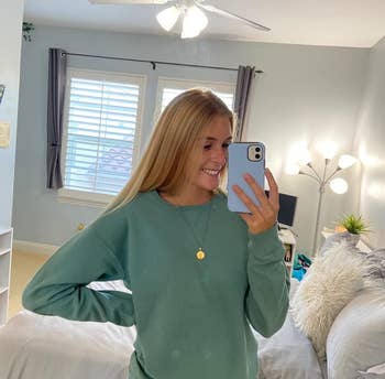 reviewer in the green crewneck