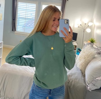 reviewer in the green crewneck