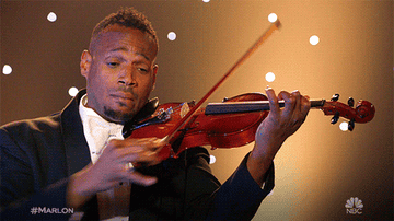 Marlon Wayans plays the violin