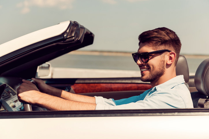 Man driving a convertible