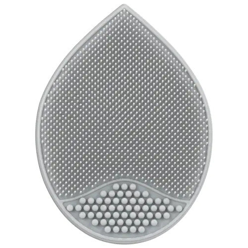a gray silicone pad with silicone bristles