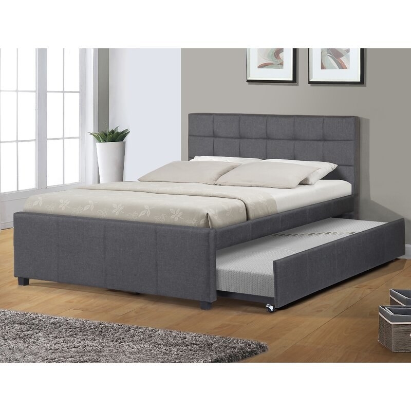 The full bed in dark gray with a trundle bed pulled out