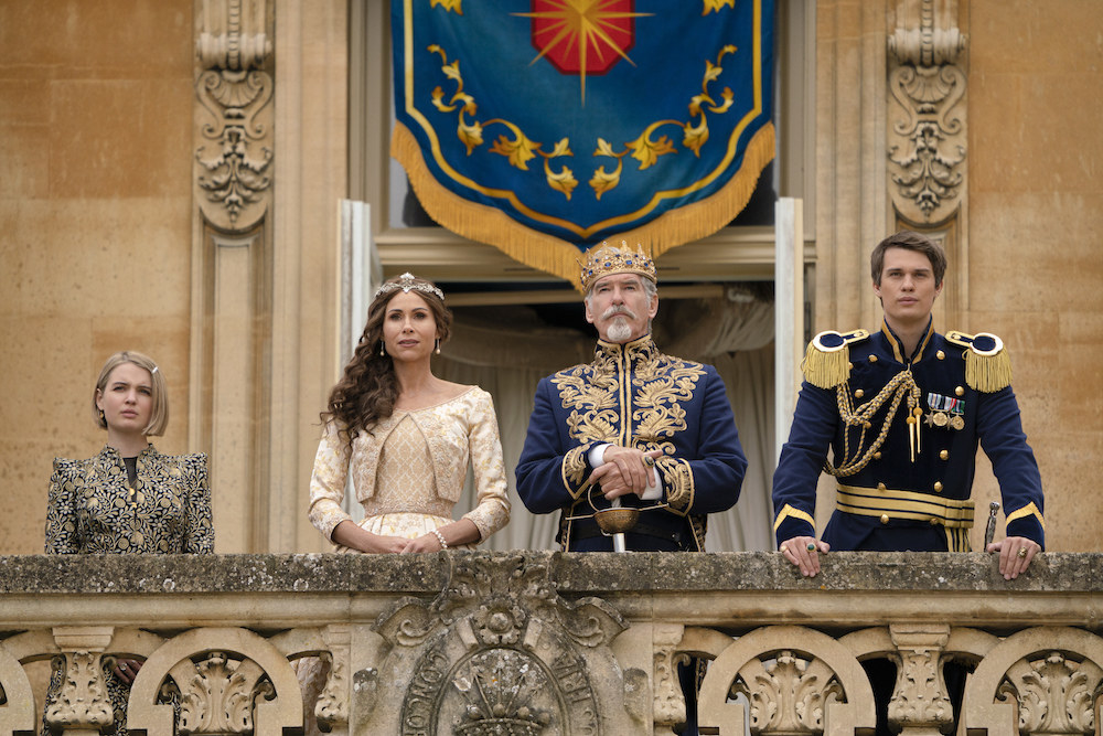 The Prince and his royal family standing on a balcony outside the palace