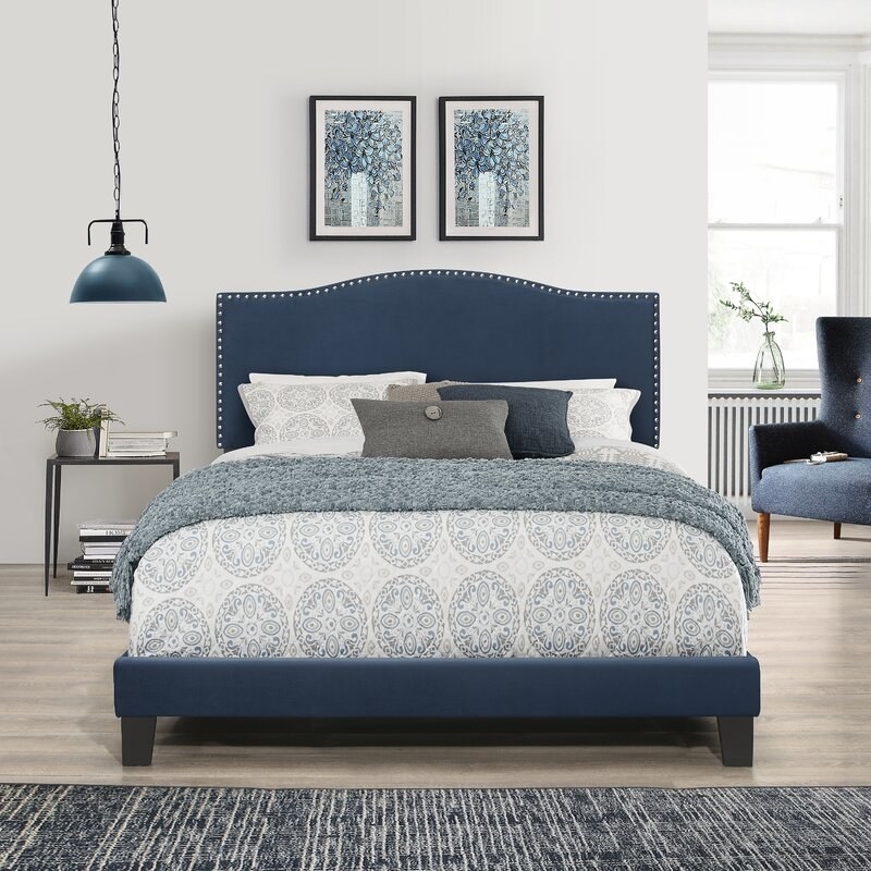 The blue bed decorated to match a bedroom