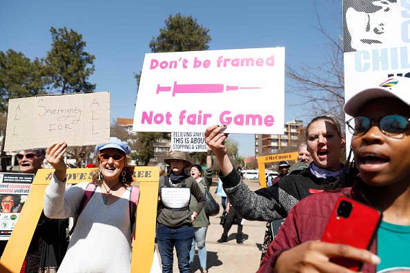 People marching at an anti-vax protest