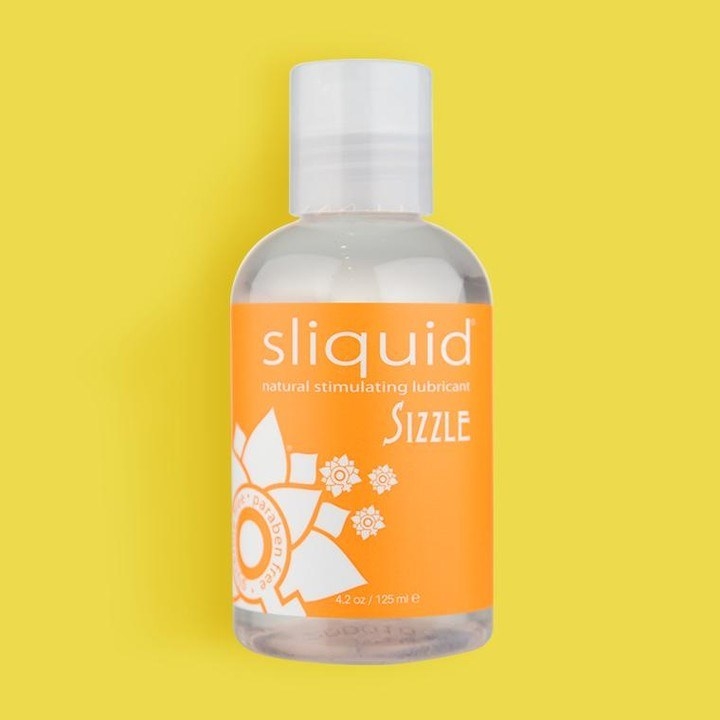 Orange bottle of Sizzle lubricant by Sliquid
