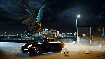Lucifer flying with Chloe over a car