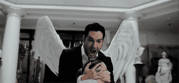 Lucifer shielding Chloe with his wings