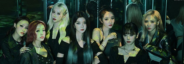 Dreamcatcher poses in a room full of mirrors