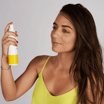 GIF of model spraying the toner on her face