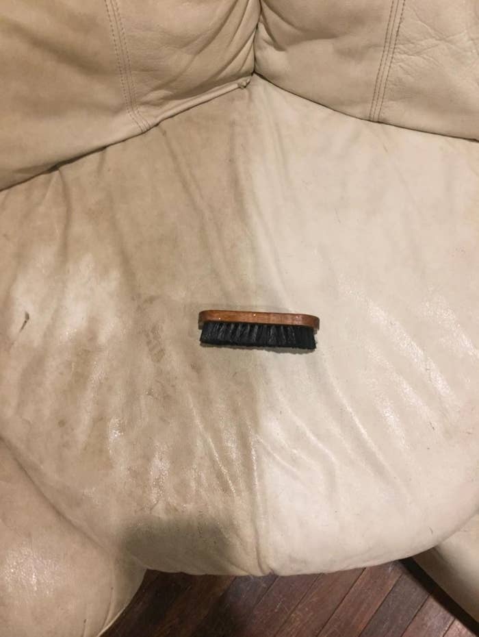 the leather cleaner being used on a reviewer's leather couch
