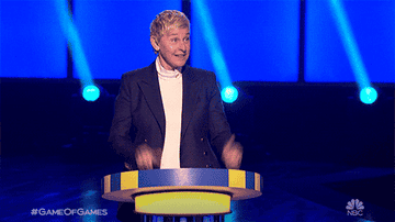 ellen on her game show giving a thumbs up