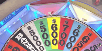 the wheel of fortune wheel slowly spinning near a $5000 marker