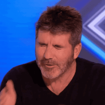 simon cowell dropping his face into his hands