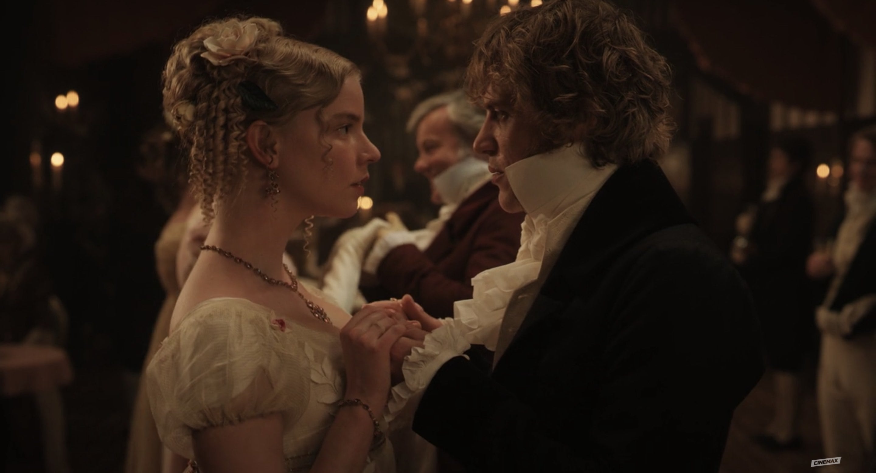 Emma and Knightley lock eyes intensely as they dance