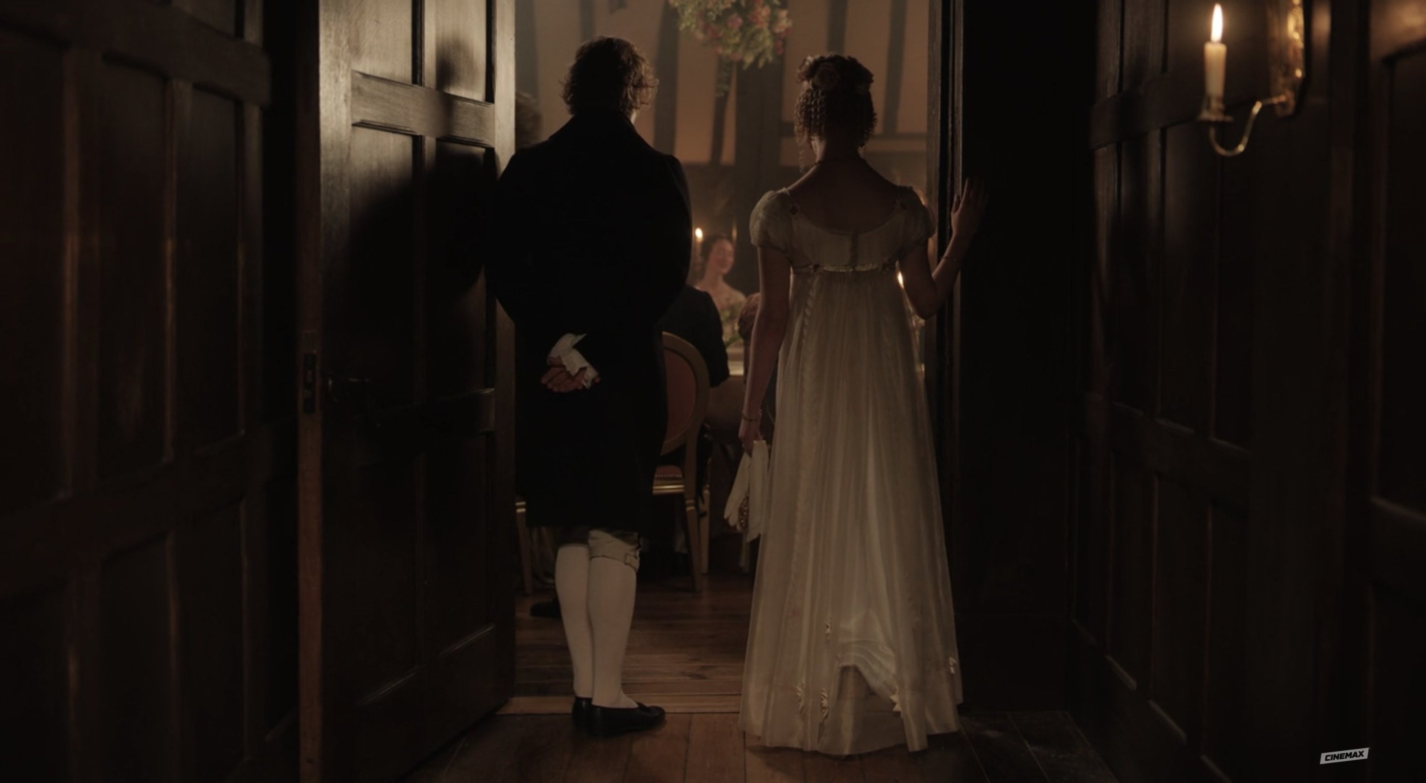 Knightley and Emma enter a room, we see them from behind