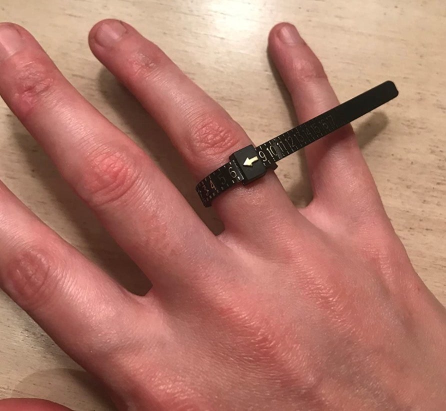 the ring sizer on a reviewer&#x27;s hand