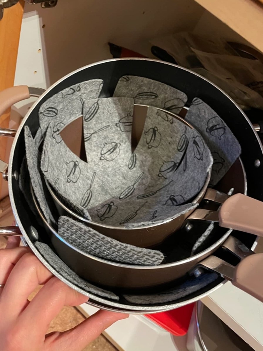 the pot and pan protectors on a reviewer&#x27;s cookware