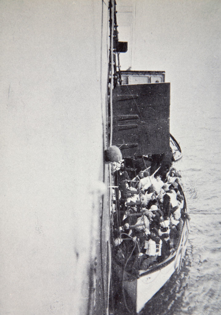 The full lifeboat being hoisted onto the Carpathia