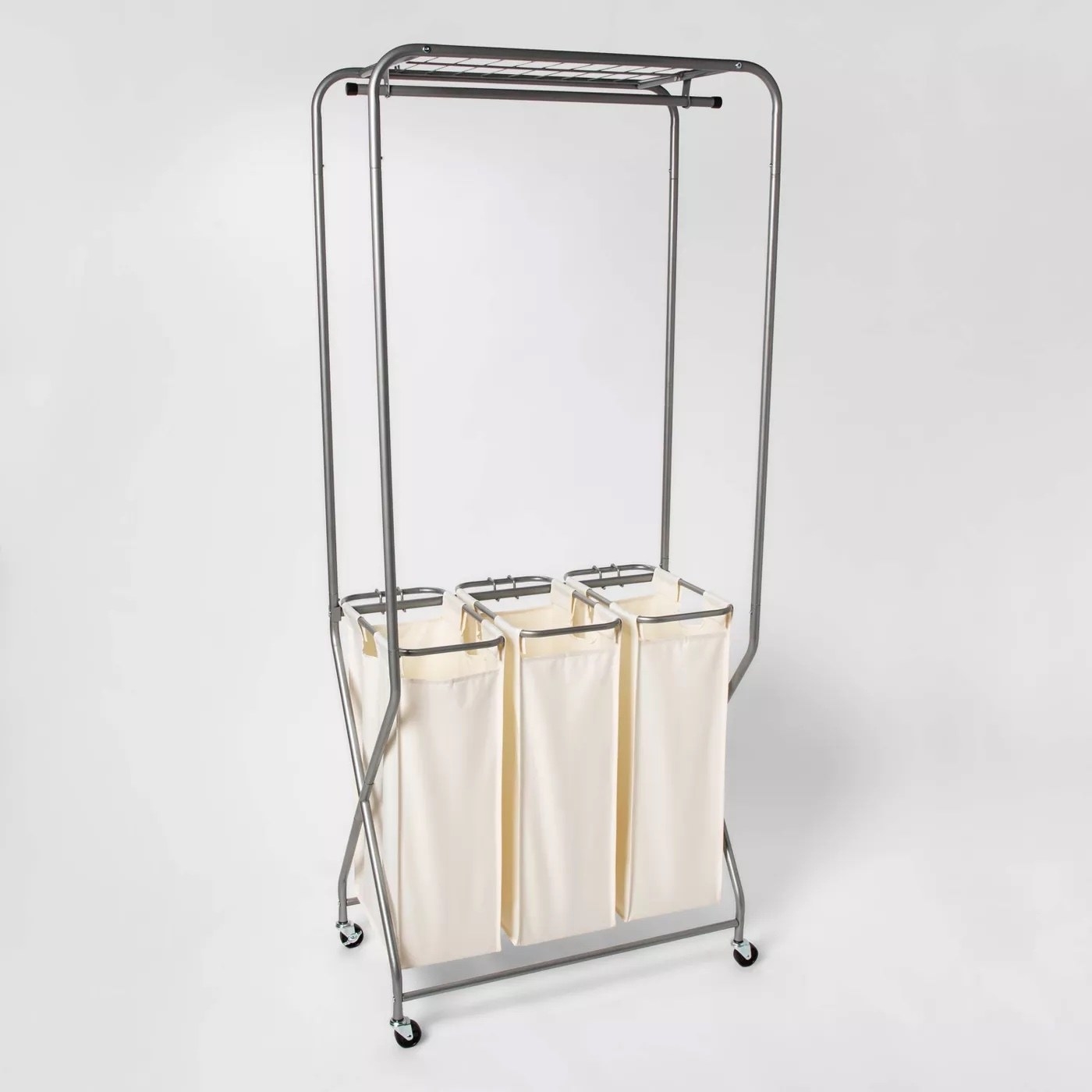 A metal laundry station with sorting bags.