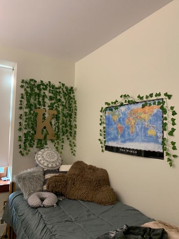 Reviewer's photo showing their dorm room decorated with the fake ivy leaves