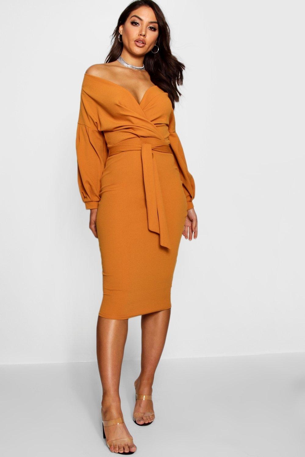 Model wearing orange dress