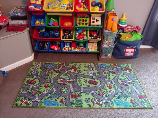 Reviewer's photo showing the carpet playmat in their child's playroom