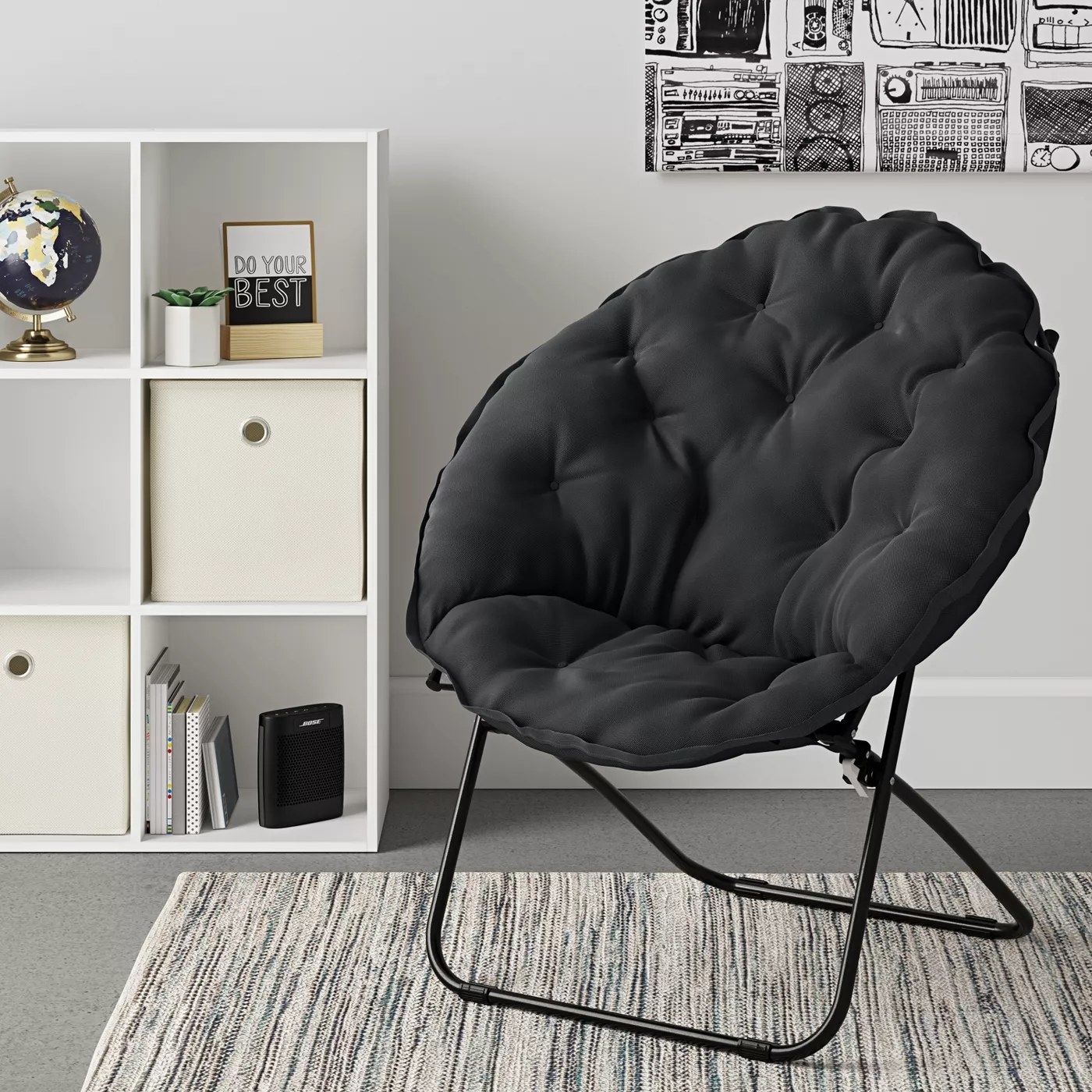 The dish-shaped chair with a tufted and cushioned seat