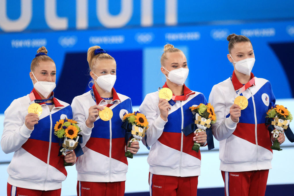Gold medallists Lilia Akhaimova, Viktoria Listunova, Andgeina Melnikova, and Vladislava Urazova (L-R) of the ROC team pose at a victory ceremony for the women&#x27;s artistic gymnastics team all-around event