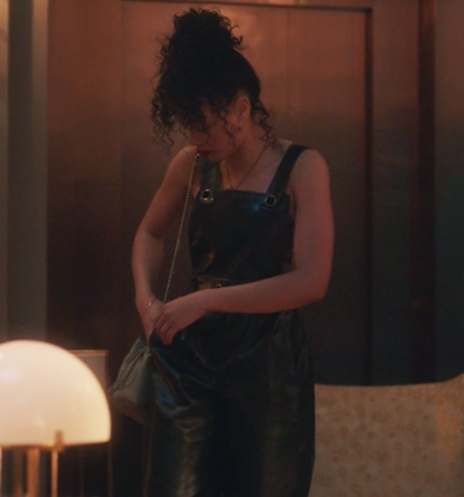 Zoya wears a leather tank top jumpsuit
