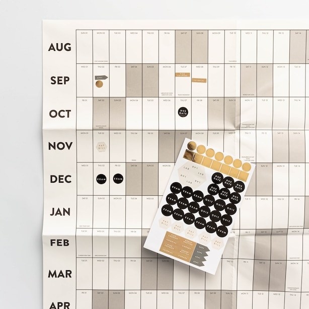 a fold up calendar to track due dates with stickers
