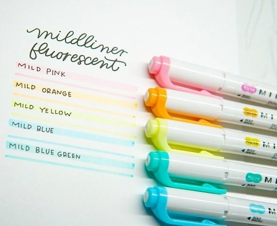 five various coloured highlighters next to drawn lines