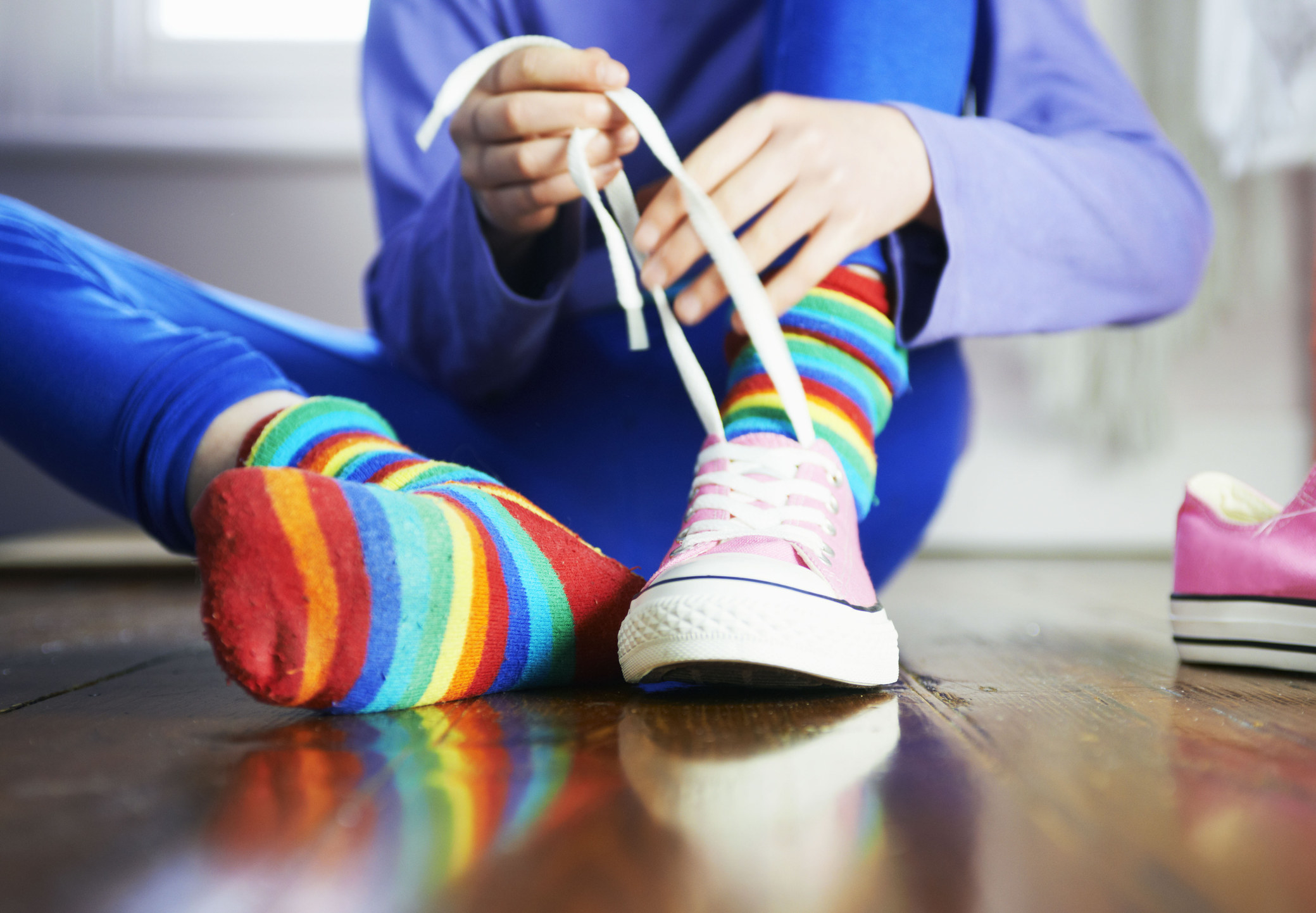 A child trying their shoes